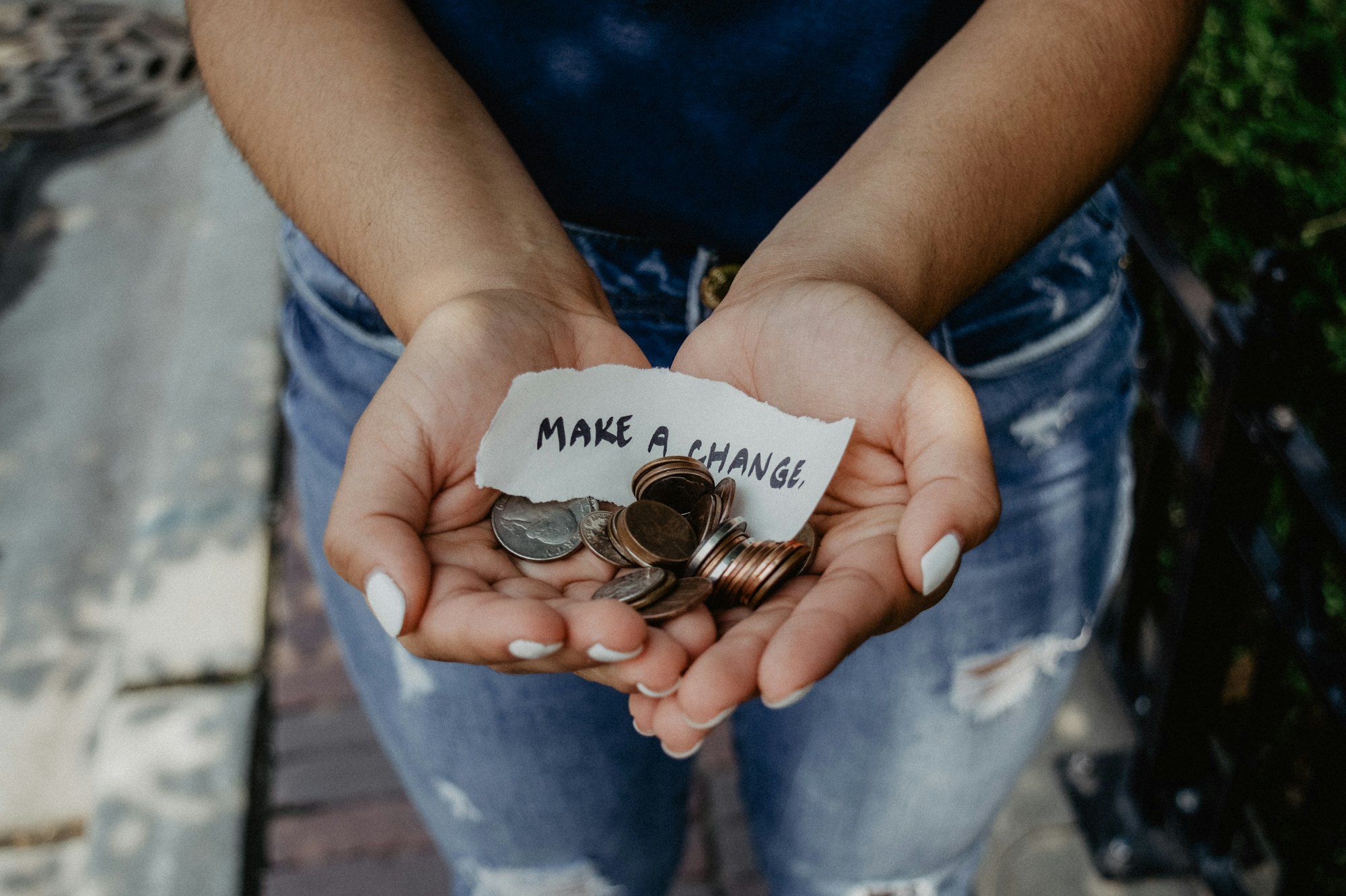 Hands passing a coin